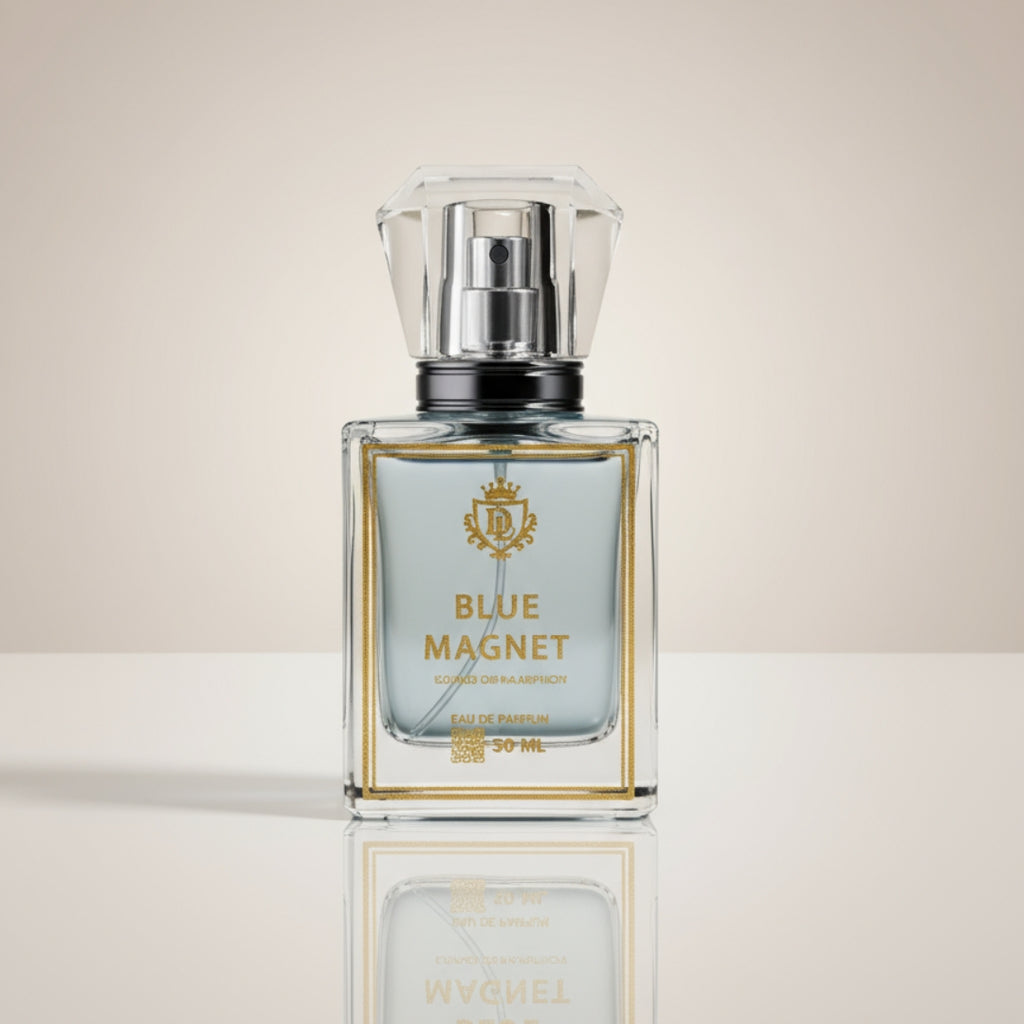 Perfume bottle labeled 'Blue Magnet' on a reflective surface with a neutral background